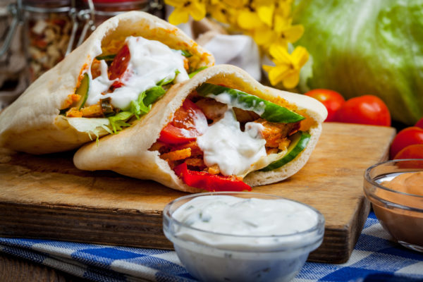 Fried chicken meat with vegetables in pita bread